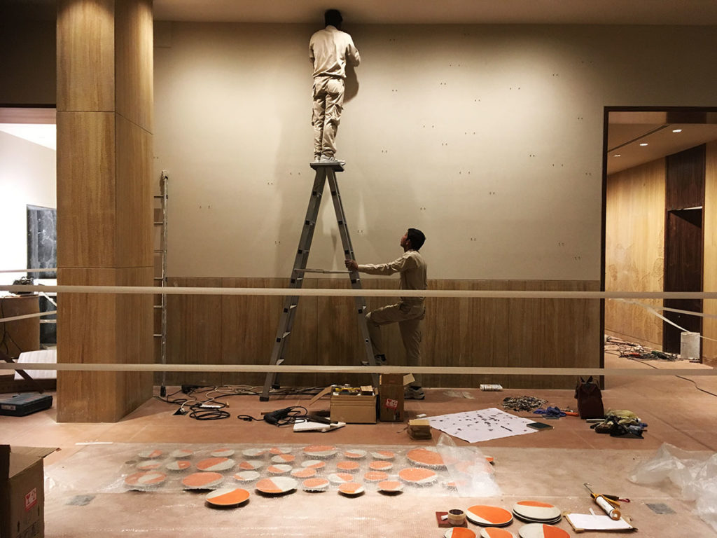The team of technicians during the installation of ceramic mural - "Solar" by Rekha Goyal