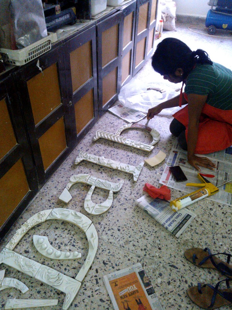 Assembling the mural from the corporate workshop