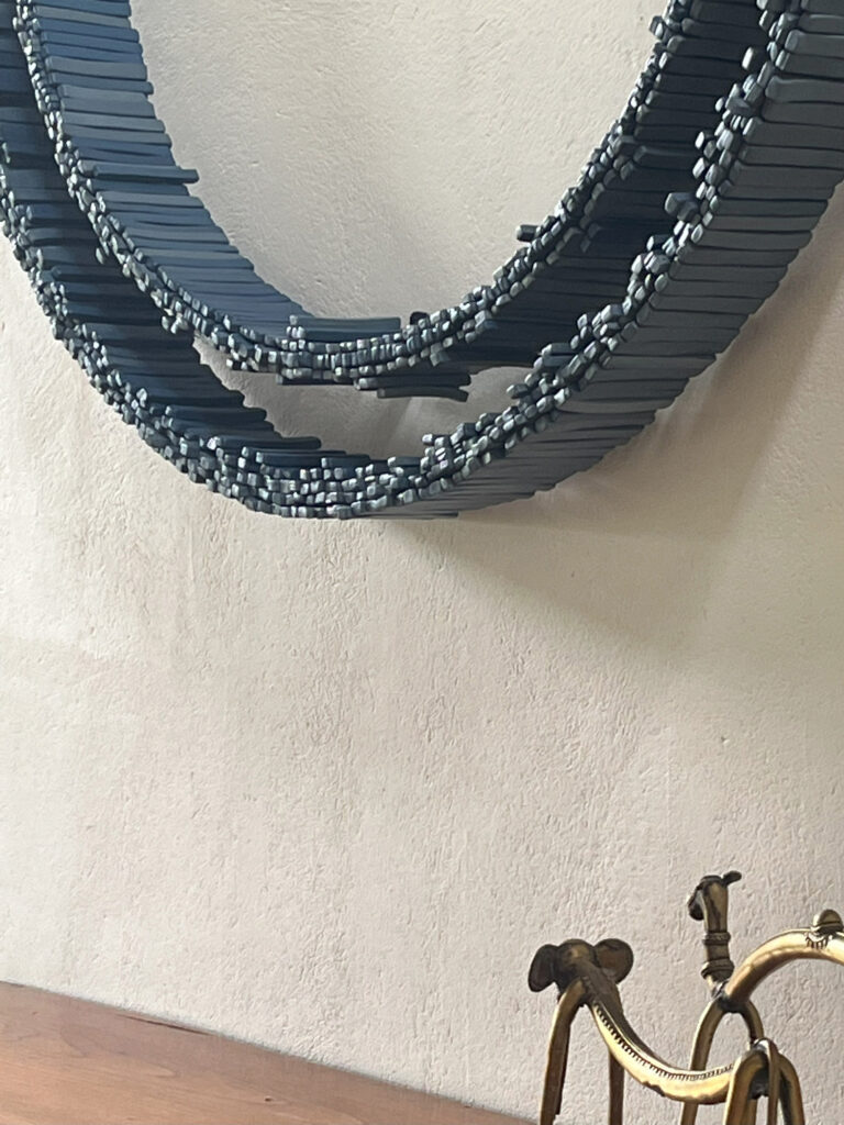 Detail shot of Particles, Collisions & the Universe - ceramic wall installation by artist Rekha Goyal